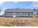 Rear view of a home with blue siding and white trim, showcasing its backyard on a clear day at 2365 28Th Ne St, Hickory, NC 28601