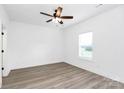Bright bedroom featuring modern ceiling fan, neutral walls, and light wood-look flooring at 2365 28Th Ne St, Hickory, NC 28601