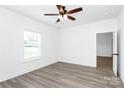 Bright, spacious bedroom featuring wood-look floors, a ceiling fan, and ample natural light at 2365 28Th Ne St, Hickory, NC 28601
