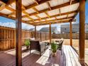 A cozy backyard patio with comfortable seating and a wooden privacy fence for secluded relaxation at 490 Melvista Ave, Rock Hill, SC 29732