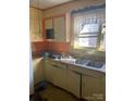 Kitchen with double sink and orange painted walls at 815 E Lafayette St, Salisbury, NC 28144