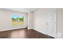 Bright bedroom with hardwood floors, neutral walls, and a window at 1029 20Th Avenue Se Loop, Hickory, NC 28602