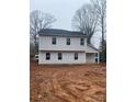 Two-story house with gray vinyl siding, showcasing a simple yet modern design at 104 Springdale St, Shelby, NC 28150