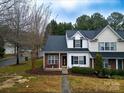 Townhouse with parking and surrounding trees at 12548 Hennigan Place Ln, Charlotte, NC 28214