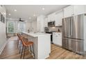 Modern kitchen with white cabinets, stainless steel appliances, and an island at 330 Simeon Dr, Charlotte, NC 28208