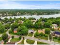 Stunning aerial view showcases a neighborhood near a pristine lake surrounded by lush greenery and distant mountains at 430 43Rd Nw Ave, Hickory, NC 28601