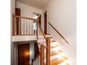 Wooden staircase with white spindles and wooden railing at 4745 16Th Street Ne Dr, Hickory, NC 28601