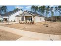 Charming craftsman style home with a welcoming front porch and nicely landscaped lawn at 6004 Barcelona Way, Charlotte, NC 28214