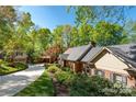Beautiful home exterior with lush greenery, large driveway and a detached garage, offering ample space at 990 19Th Nw Ave, Hickory, NC 28601