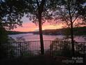 Stunning sunset view overlooking the tranquil lake, creating a peaceful and scenic backdrop at 990 19Th Nw Ave, Hickory, NC 28601