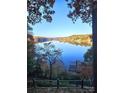 Picturesque lake view surrounded by vibrant fall foliage, with a private dock for serene waterfront enjoyment at 990 19Th Nw Ave, Hickory, NC 28601