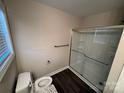 Clean bathroom with a sliding glass shower door and granite vanity at 1014 N Main St, China Grove, NC 28023