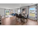 Open floor plan with dining and living areas, hardwood floors, and lots of natural light at 1024 20Th Avenue Se Way, Hickory, NC 28602