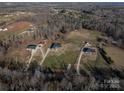 Aerial view of a rural property with multiple houses and large lots at 1370 Null Rd, Lincolnton, NC 28092