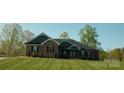 Charming brick home featuring a symmetrical design, gabled roof, and well-maintained lawn at 1370 Null Rd, Lincolnton, NC 28092