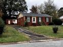 Brick ranch house with a detached workshop at 1810 Trentwood Pl, Charlotte, NC 28216