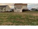 Spacious backyard with a large grassy area behind the house at 1916 Seefin Ct, Indian Trail, NC 28079