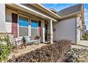 Relaxing front porch with rocking chairs and a bench at 7029 Overjoyed Xing, Charlotte, NC 28215