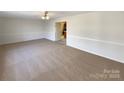 Spacious living room with neutral carpeting and a ceiling fan at 801 Crestridge Rd, Statesville, NC 28677