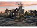 Condo building exterior, featuring multiple units and parking at 8103 Cedar Glen Dr, Charlotte, NC 28212