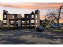 Exterior of a condo building with parking in front at 8103 Cedar Glen Dr, Charlotte, NC 28212