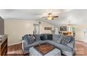 Living room with a gray sectional, ottoman and built-in shelving at 980 Bear Poplar Rd, Cleveland, NC 27013