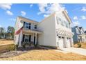Two-story house with gray siding, two-car garage, and a small front porch at 11058 Argosy Dr, Lancaster, SC 29720
