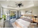 Virtually staged main bedroom with sliding glass doors to a deck at 1324 Crawford Rd # 6, Rock Hill, SC 29730