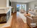 Inviting living room with fireplace and sliding doors that open to a relaxing lake view at 17931 Kings Point Dr # G, Cornelius, NC 28031