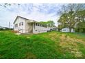 Back of the house showing a deck and a large backyard at 2085 Faith Rd, Salisbury, NC 28146