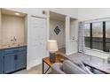 Comfortable living room area with a convenient wet bar, perfect for entertaining guests and relaxation at 421 N Church St # 12F, Charlotte, NC 28202