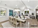Bright dining room with a large table, chandelier, and access to the living room at 5053 Townsend Rd, Lancaster, SC 29720