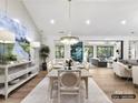 Open concept dining room with table, chandelier, and view into Gathering room at 5053 Townsend Rd, Lancaster, SC 29720