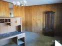 Simple dining room with wood paneling, wood furniture at 744 N Little Egypt Rd, Denver, NC 28037