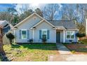 Ranch style home with gray siding, landscaping, and walkway at 842 Wilcrest Ct, York, SC 29745