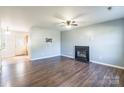 Living room with fireplace, hardwood floors, and ceiling fan at 842 Wilcrest Ct, York, SC 29745