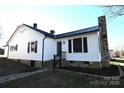 Charming white house with stonework, a walkway, and landscaping at 9 N 11Th Ave, Maiden, NC 28650