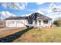 White house with a two-car garage and a front porch at 956 Stony Point Rd, Kings Mountain, NC 28086