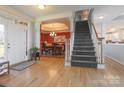Hardwood floor entryway with staircase and view of dining room at 104 Fox Den Cir, Statesville, NC 28677