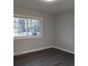 Spacious bedroom with grey walls and dark grey vinyl plank flooring at 1408 Delview Rd, Cherryville, NC 28021