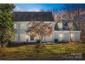 Gray two-story house with a tree in front and a manicured lawn at 2702 Oxborough Dr, Matthews, NC 28105