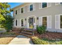 Brick steps leading to a front door with a glass insert and sidelights at 2702 Oxborough Dr, Matthews, NC 28105