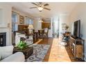 Bright and spacious living room with hardwood floors and a fireplace at 5998 Village Nw Dr, Concord, NC 28027