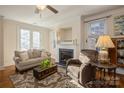 Living room with fireplace, hardwood floors, and French doors at 5998 Village Nw Dr, Concord, NC 28027