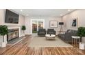 Spacious living room featuring a fireplace and access to a backyard at 6130 Heath Ridge Ct, Charlotte, NC 28210