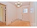 Bright entryway with hardwood floors and chandelier at 936 23Rd Ne Ave, Hickory, NC 28601