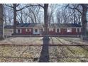 Brick ranch house with mature trees and fenced yard at 936 23Rd Ne Ave, Hickory, NC 28601