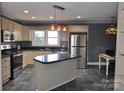 Updated kitchen with island and stainless steel appliances at 109 Shamrock Dr, Chester, SC 29706