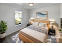 Bright bedroom with wood bed frame and neutral decor at 113 Boiling Brook Dr, Statesville, NC 28625