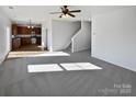 Spacious living room with neutral carpet and lots of natural light at 113 Boiling Brook Dr, Statesville, NC 28625